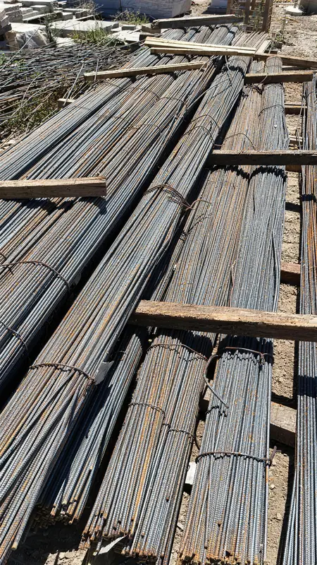 Structural rebar organized by size and gauge, essential for concrete reinforcement in construction projects.
