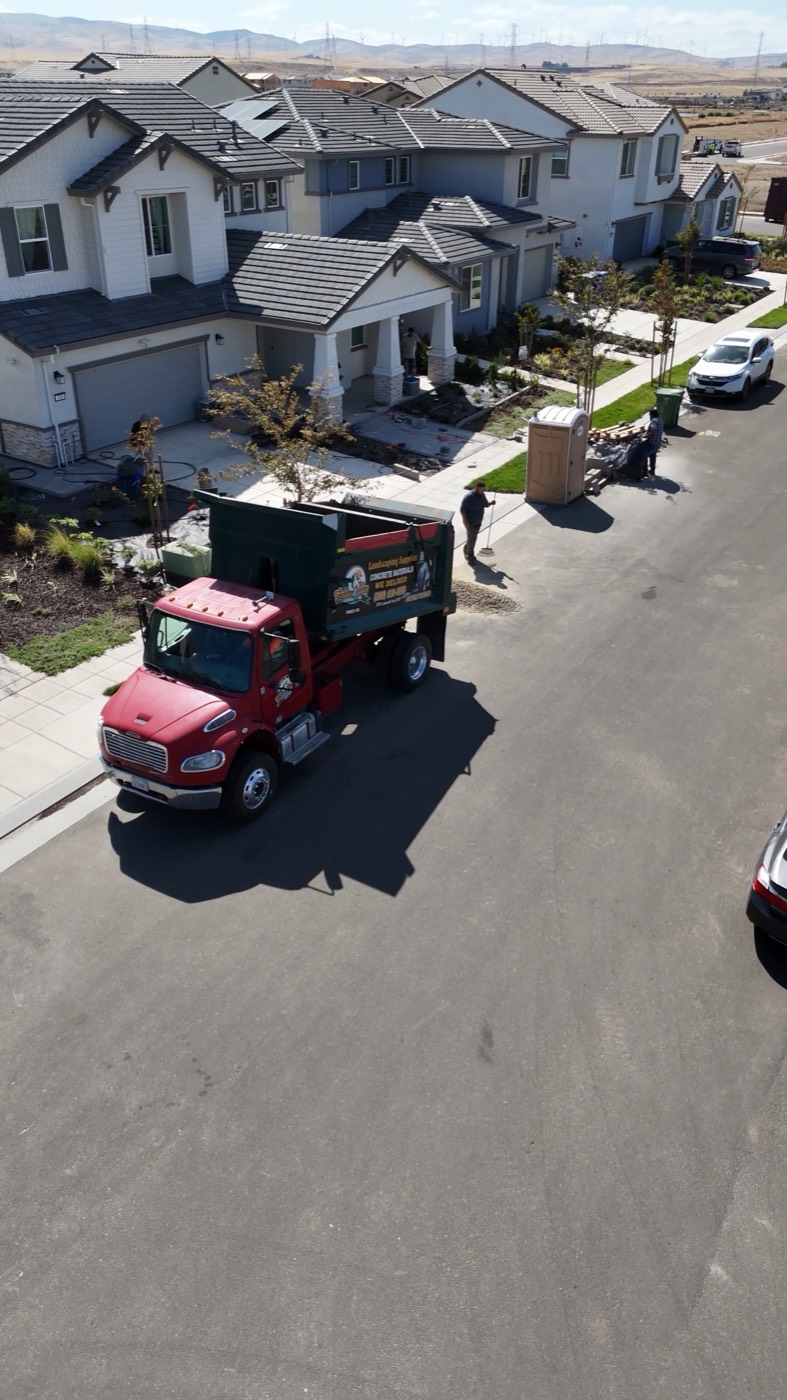 Golden Valley Materials dump truck arriving to deliver material on a residential street