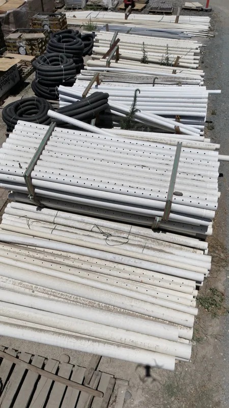 Rows of PVC pipe, perforated drain pipe and corrugated tubing in a range of sizes, ready for pickup or delivery.