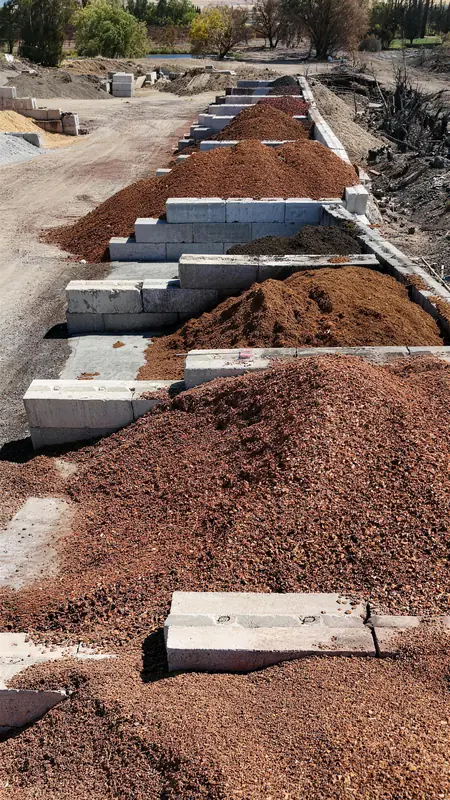 Aerial view of our mulch and bark selection, featuring multiple varieties organized by type and color for easy comparison.