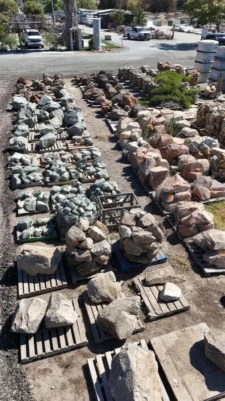 Natural landscape boulders available in a range of sizes and earth tones, ideal for creating dramatic focal points in outdoor spaces.