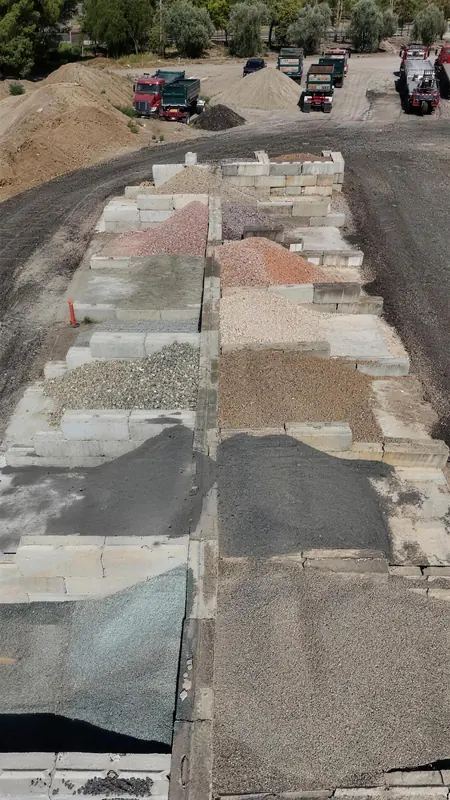 A wide view of our gravel inventory, demonstrating the scale and variety of aggregate materials we keep in stock.