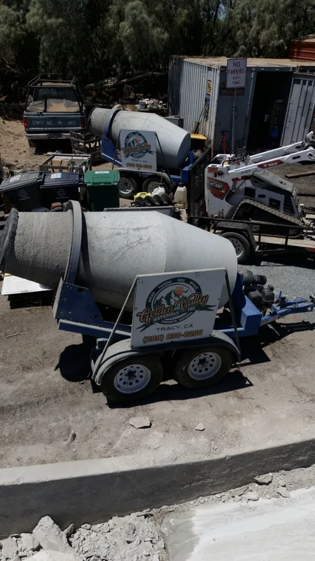 Towable concrete mixer available for rent, part of our on-site fleet of tools and equipment for your project.