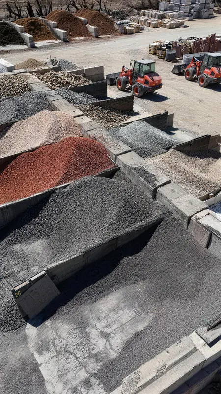 An active day at our materials yard, with equipment moving product and serving customers across our expansive lot.