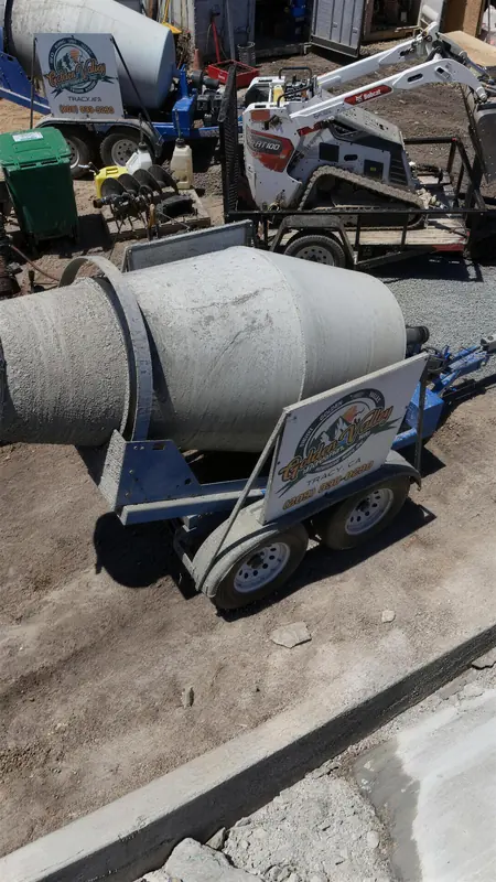 A closer look at our towable concrete mixer trailer with the Golden Valley Materials sign.